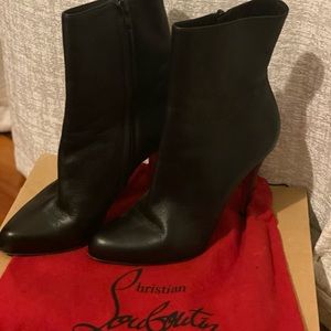 Louboutin black boot. Hits above ankle about low calf.